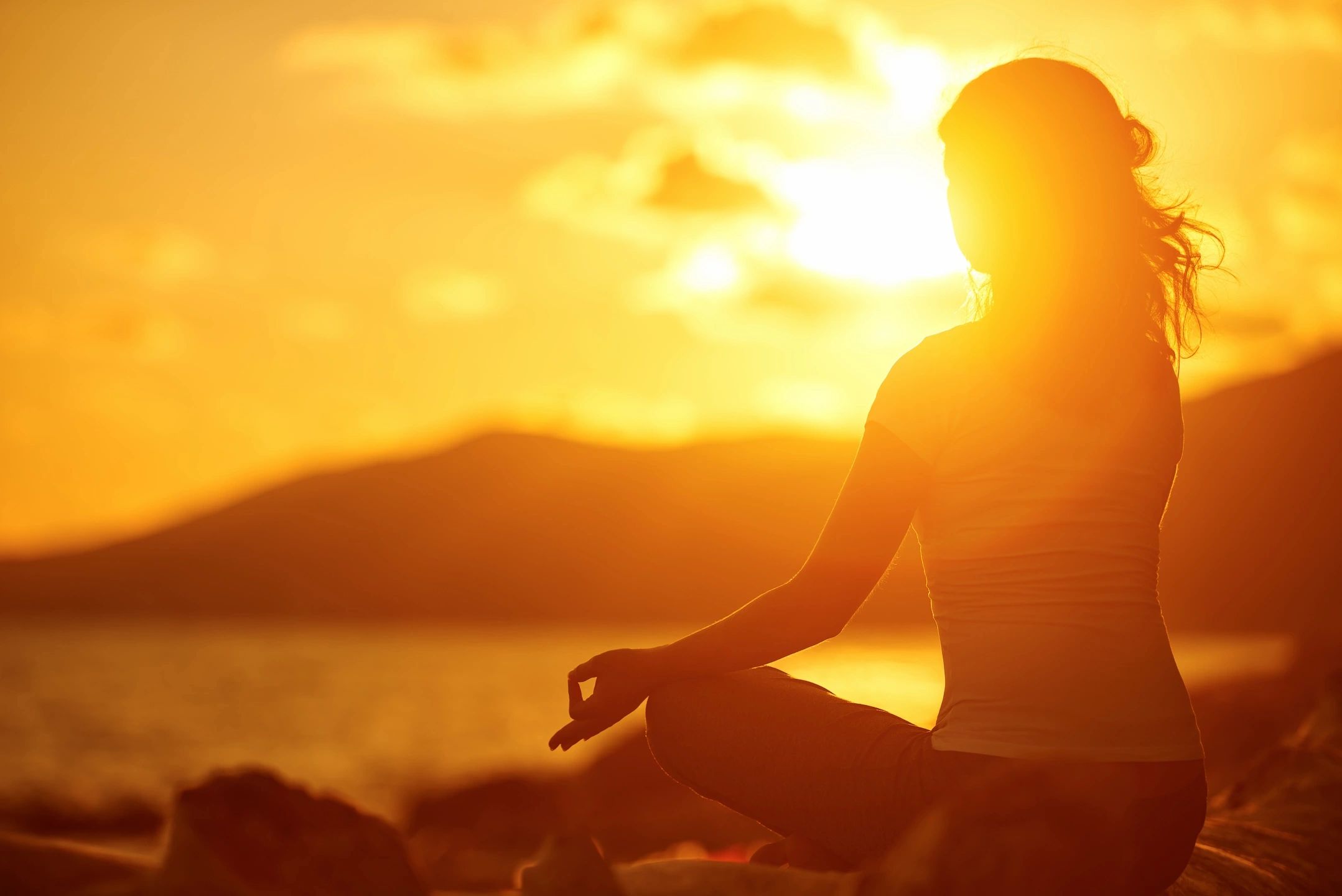 sunset woman doing yoga